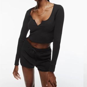 tna long sleeve cropped thermal waffle scoop neck top in a brown/purple color